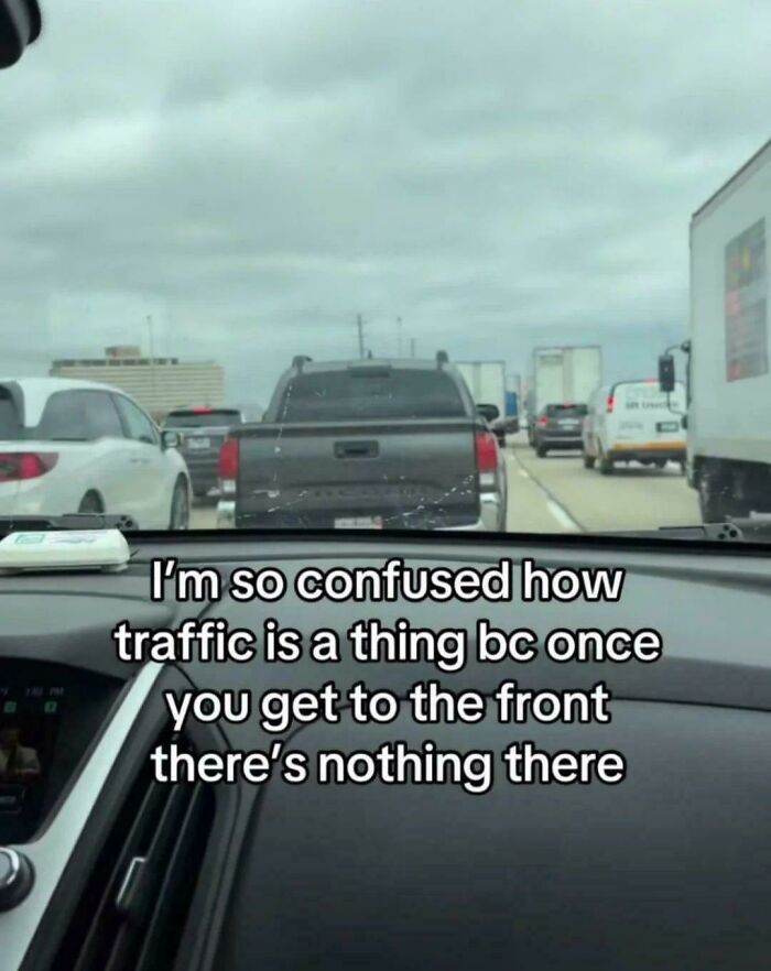 View from inside a car stuck in traffic with meme text about confusing traffic that hits close to home.