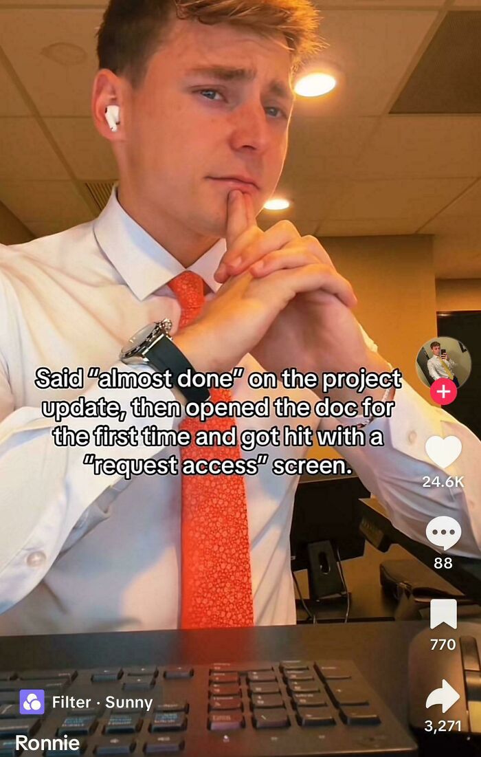 Young man in office attire, frustrated with project update and access request screen, relatable posts and memes about life moments.