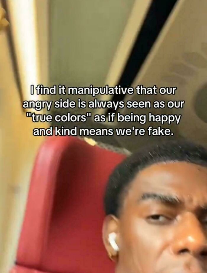 Person with earbuds on a train expressing thoughts on anger and kindness in relatable posts and memes about our lives.