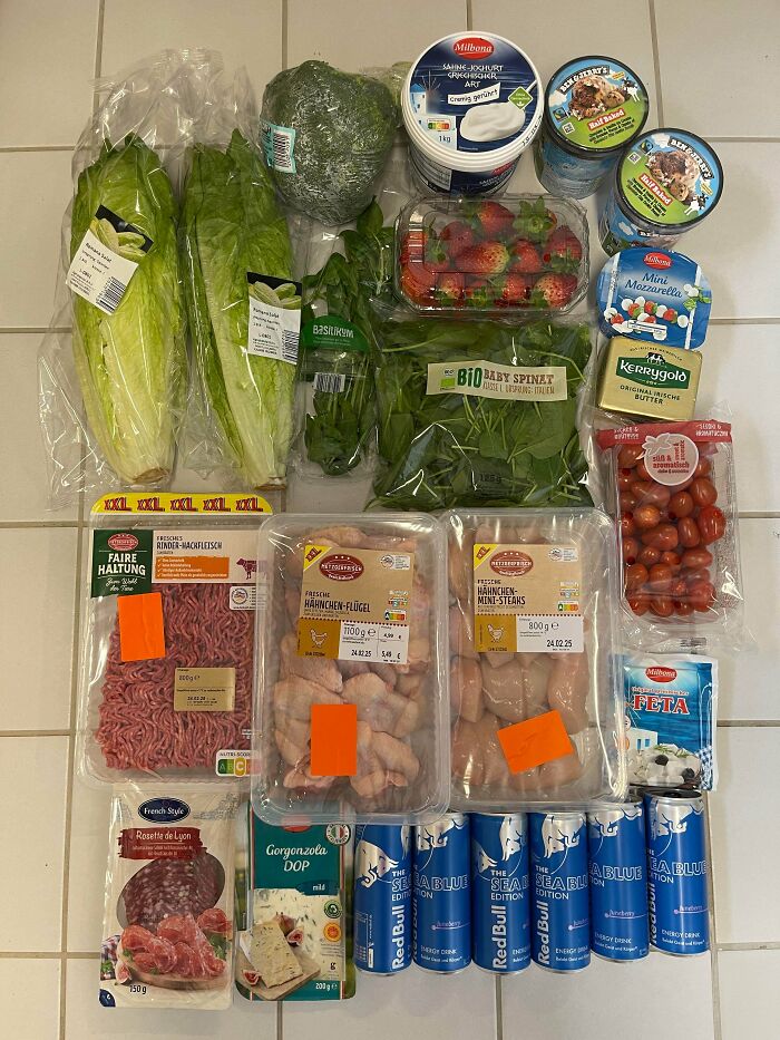 Groceries including fresh vegetables, dairy, meat, and drinks displayed to show grocery cost where they live.