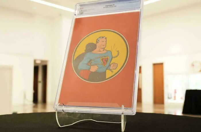 A rare Superman comic book displayed in a protective case, a truly interesting photo.