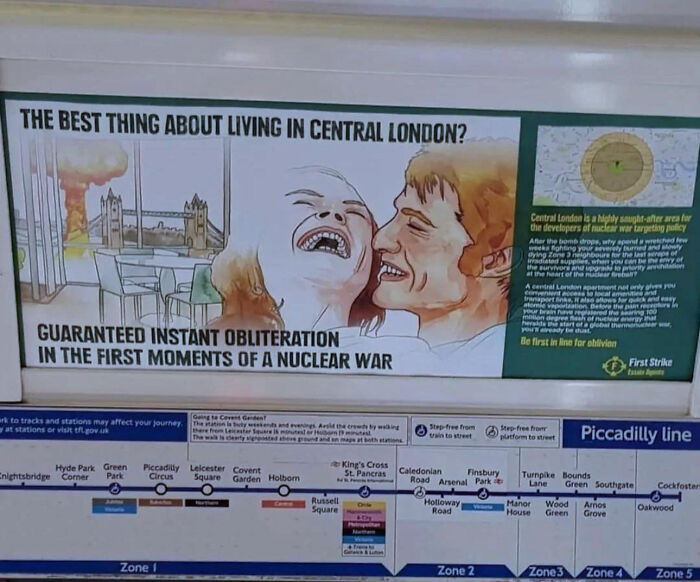A propaganda poster on a London Underground wall, displaying people saying 'D**n, That's Interesting' with a nuclear explosion.