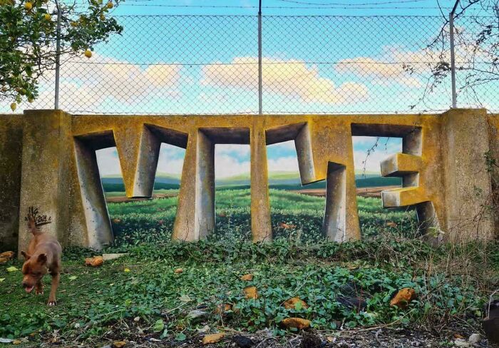 Interesting optical illusion of a word in concrete, blending with the natural landscape in a captivating way.