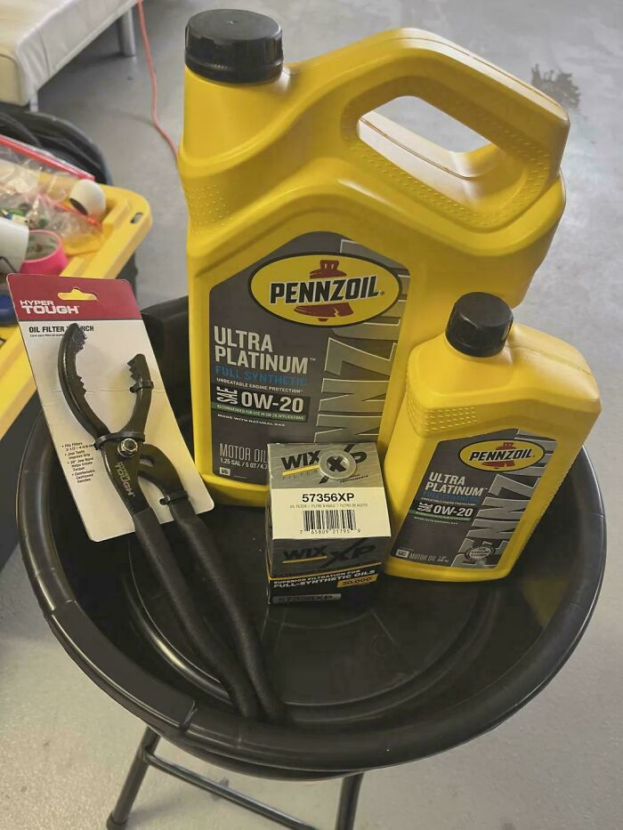 Car oil change supplies: Pennzoil motor oil, Wix oil filter, and a filter wrench. Frugal tips for car maintenance.