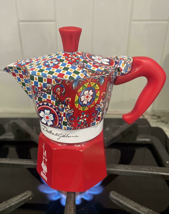Dolce & Gabbana Bialetti moka pot on a gas stove. Unlocked A Whole New World with frugal tips for this economy.