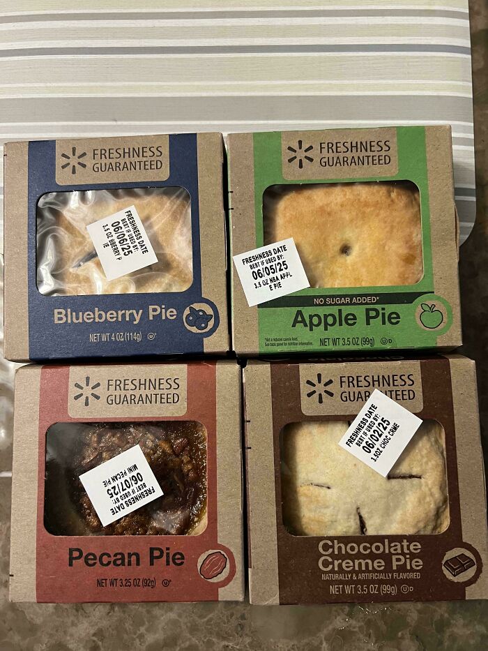 Four mini Walmart pies: blueberry, apple, pecan, and chocolate creme, showing freshness dates. Great for frugal tips.