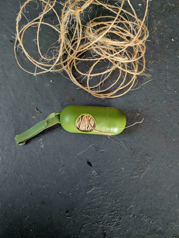 A tangle of twine and a green dispenser, illustrating frugal tips for a new world.
