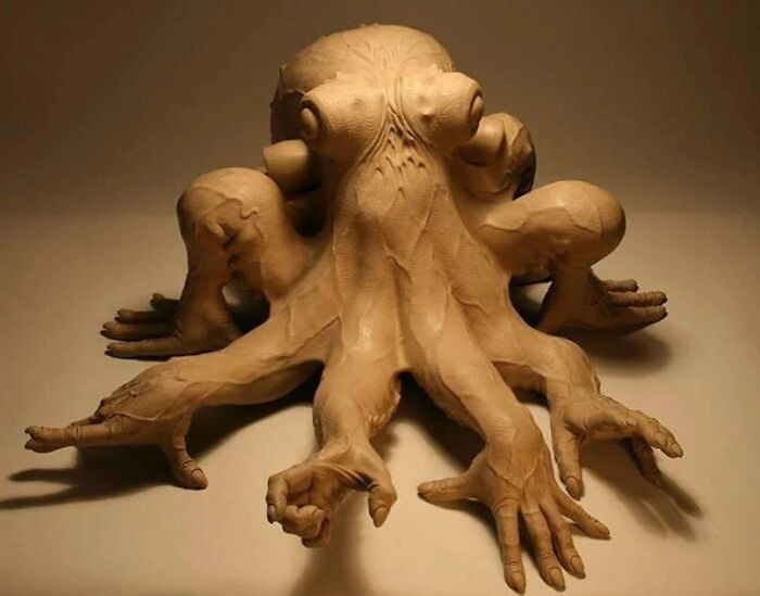 Octopus sculpture with human-like hands showcasing flawless craftsmanship