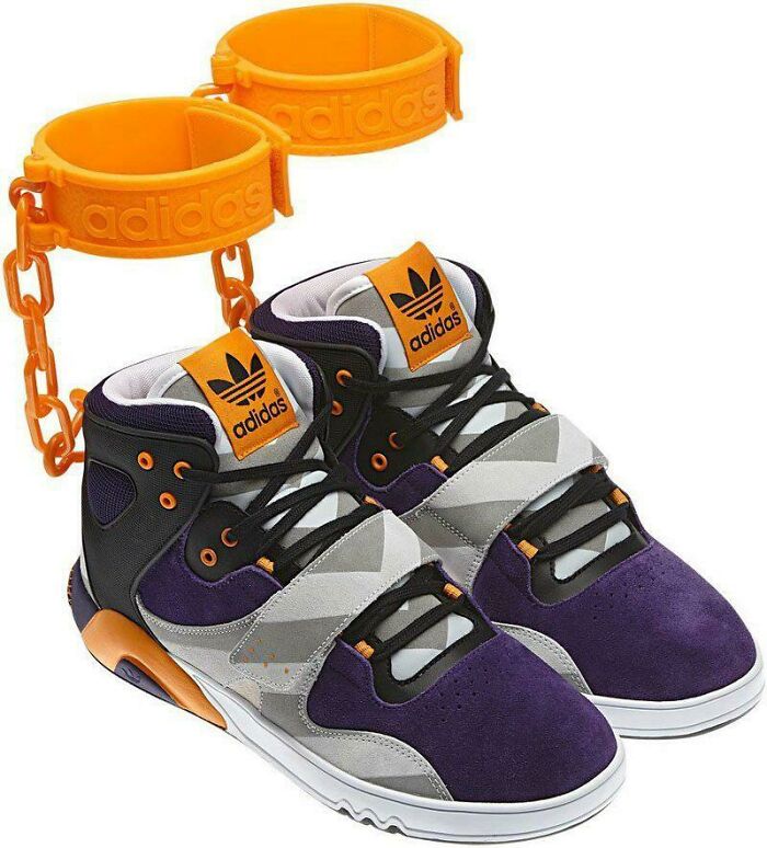 Adidas sneakers with attached orange ankle cuffs and chains showcasing unusual craftsmanship
