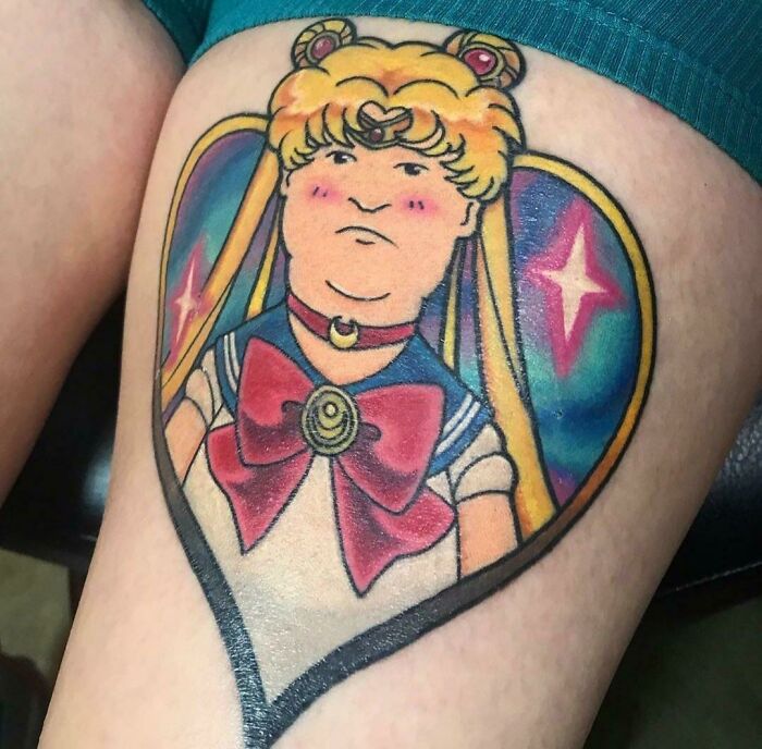 Tattoo of cartoon character Sailor Moon with humorous expression