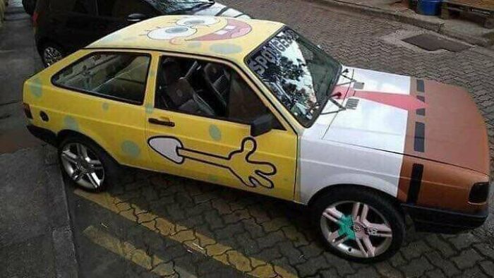 Yellow car painted with SpongeBob character design showing craftsmanship wasted on weird concept
