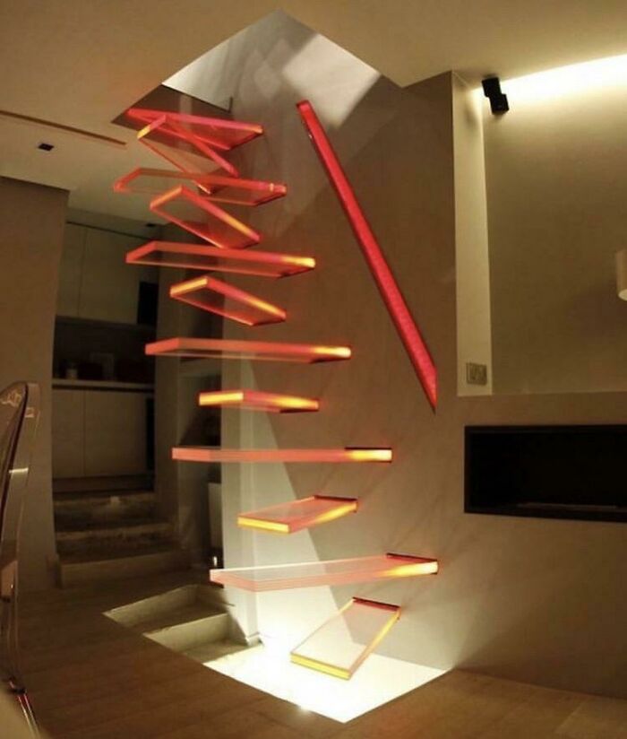 Modern floating staircase with glowing red steps showcasing innovative craftsmanship