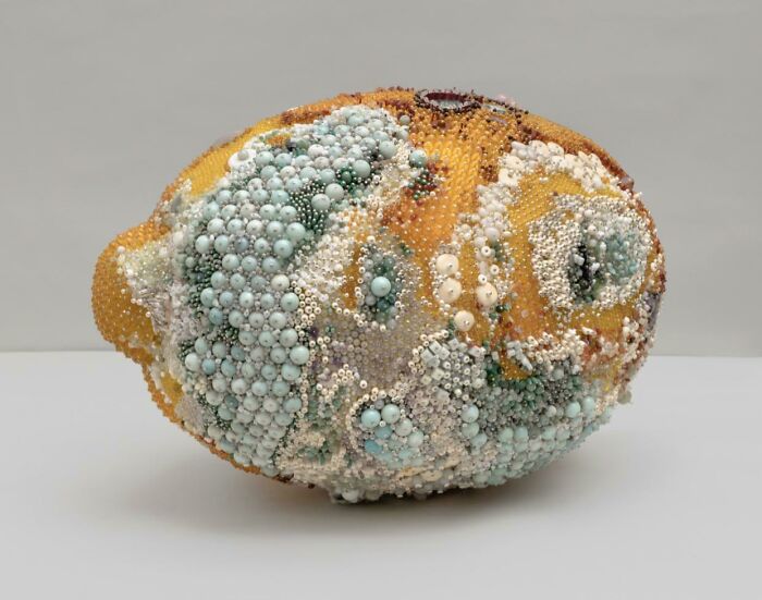 Beaded sculpture resembling a detailed artistic lemon with intricate craftsmanship