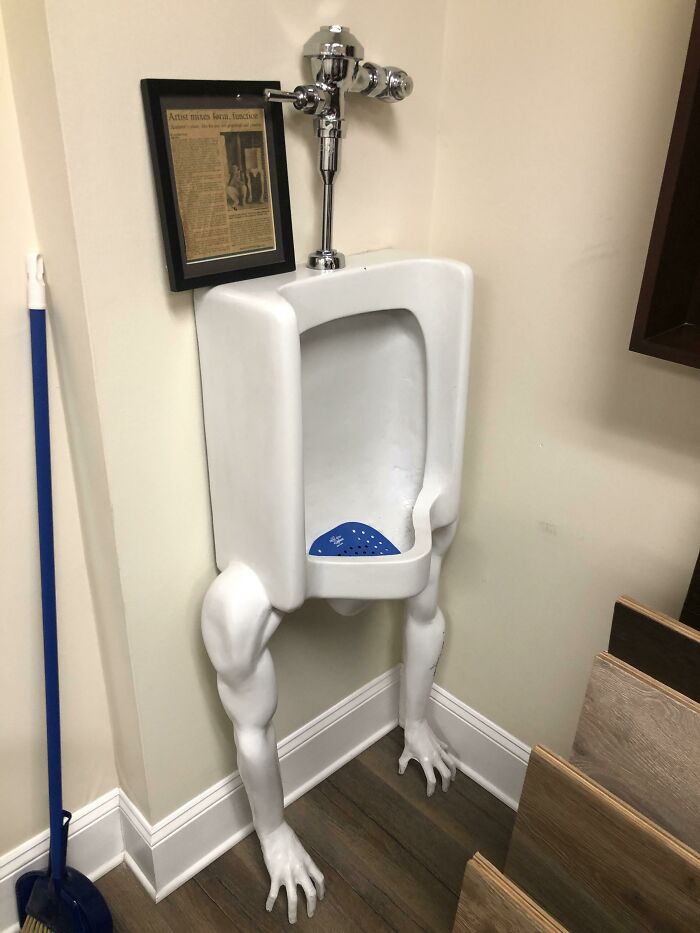 Urinal with realistic sculpted human legs and feet in creative design