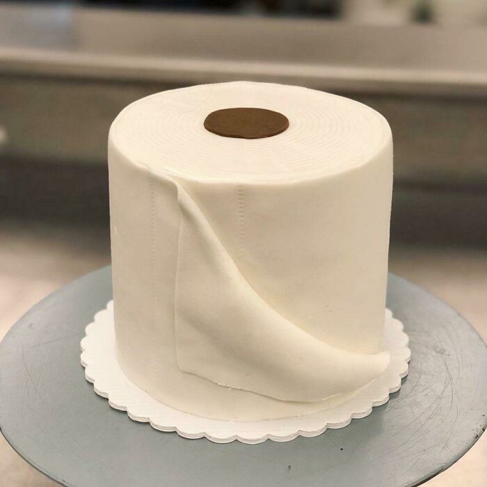 Realistic flawless craftsmanship cake designed like a roll of toilet paper