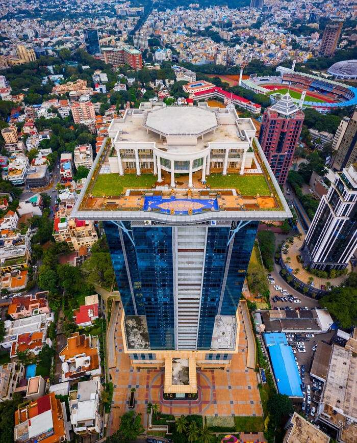 Aerial view of a modern building in cityscape with unusual architecture concept