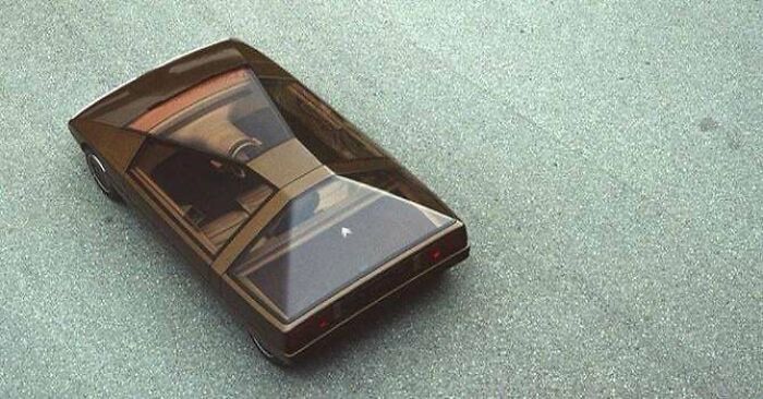 Retrofuturism concept car with sleek black angular design and large transparent canopy