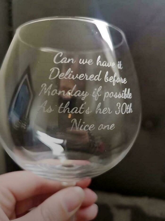 Wine glass with engraved text showing a hilarious misprint from people failing to understand instructions.