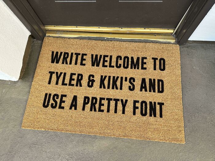 Doormat with a hilarious misprint showing failed instructions to write a welcome message using a pretty font.