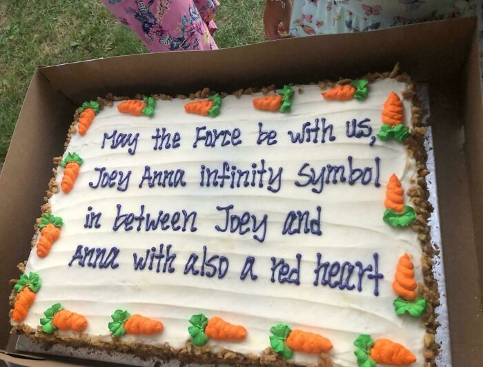 Cake with a hilarious misprint failing to understand instructions, featuring carrot decorations and confusing message text.