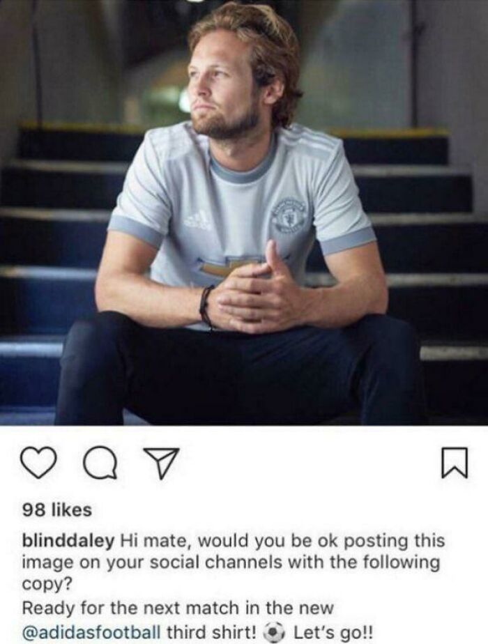 Man sitting on stairs wearing a Manchester United third shirt, illustrating funny fails and hilarious misprints in instructions.