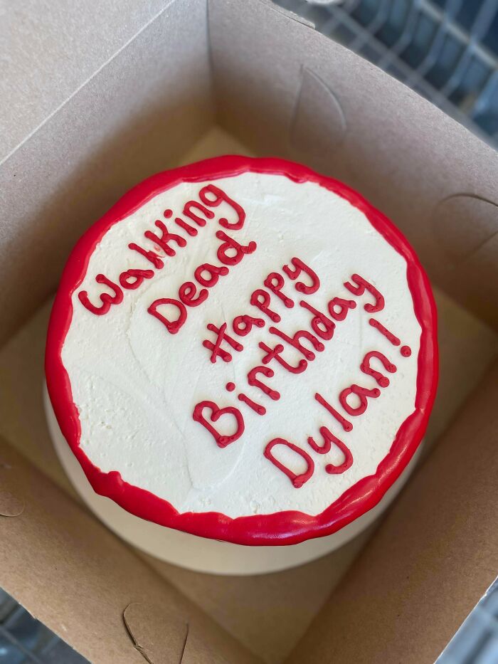 Birthday cake with a hilarious misprint that says Walking Dead instead of Happy Birthday in a red and white design.