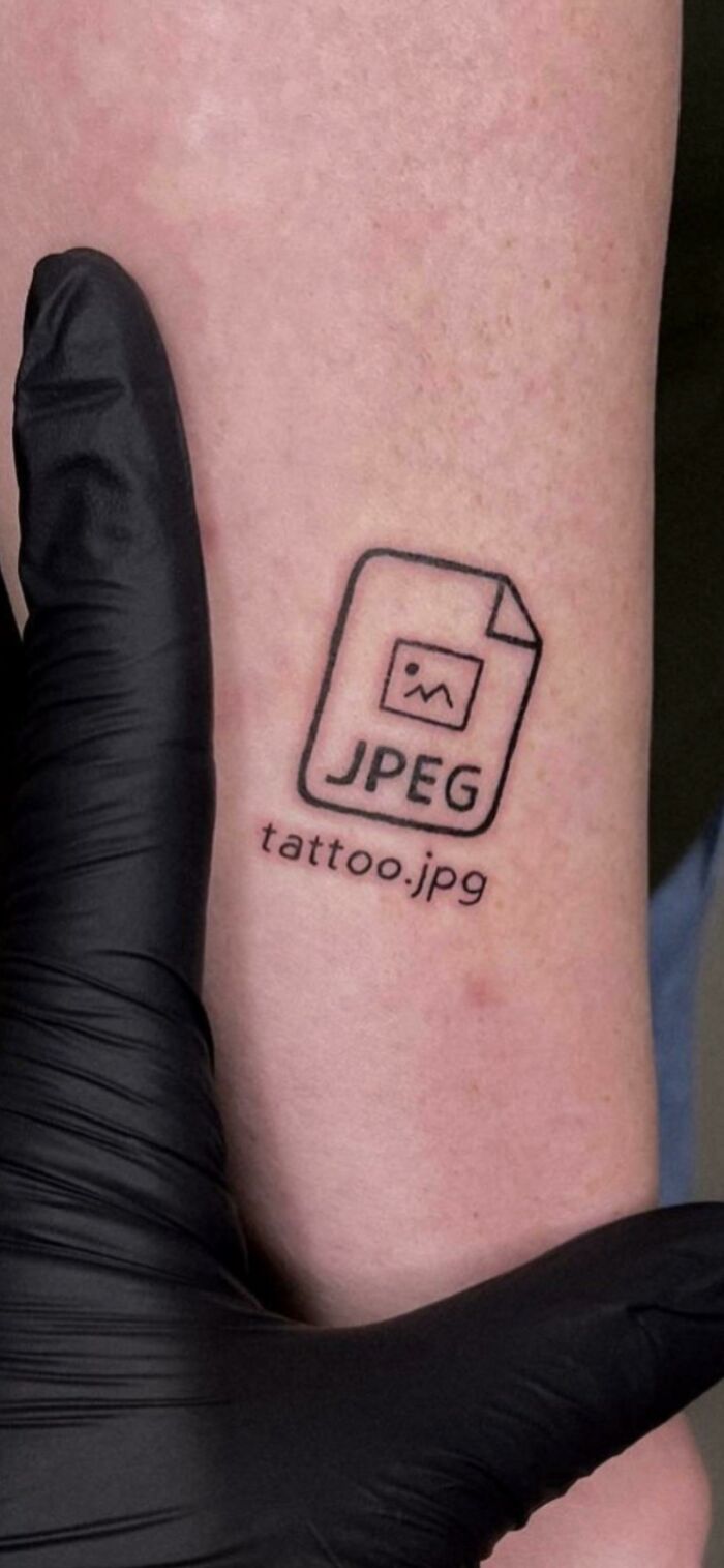 Tattoo of a JPEG file icon with the label tattoo.jpg on forearm, showing hilarious misprints and failed instructions.