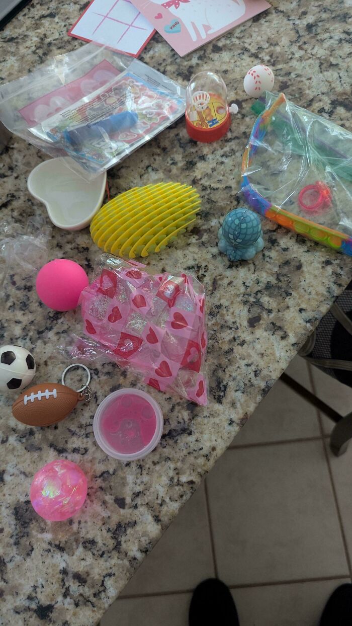 A collection of small toys and trinkets highlighting consumerism and price differences.