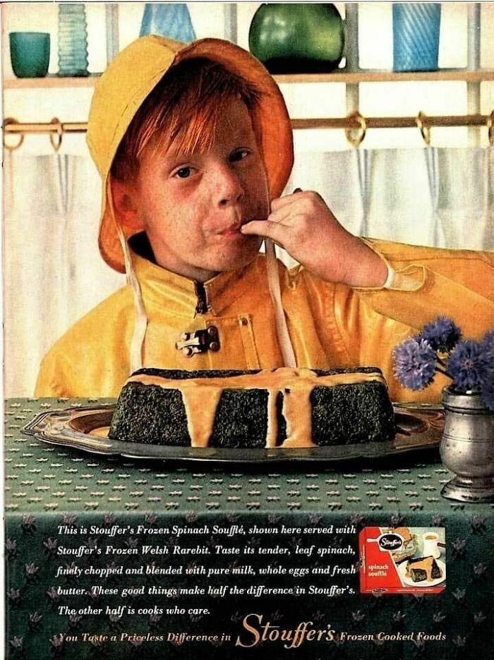 Young boy in a yellow raincoat tasting Stouffer's frozen spinach soufflé in a retro ad capturing a different era.