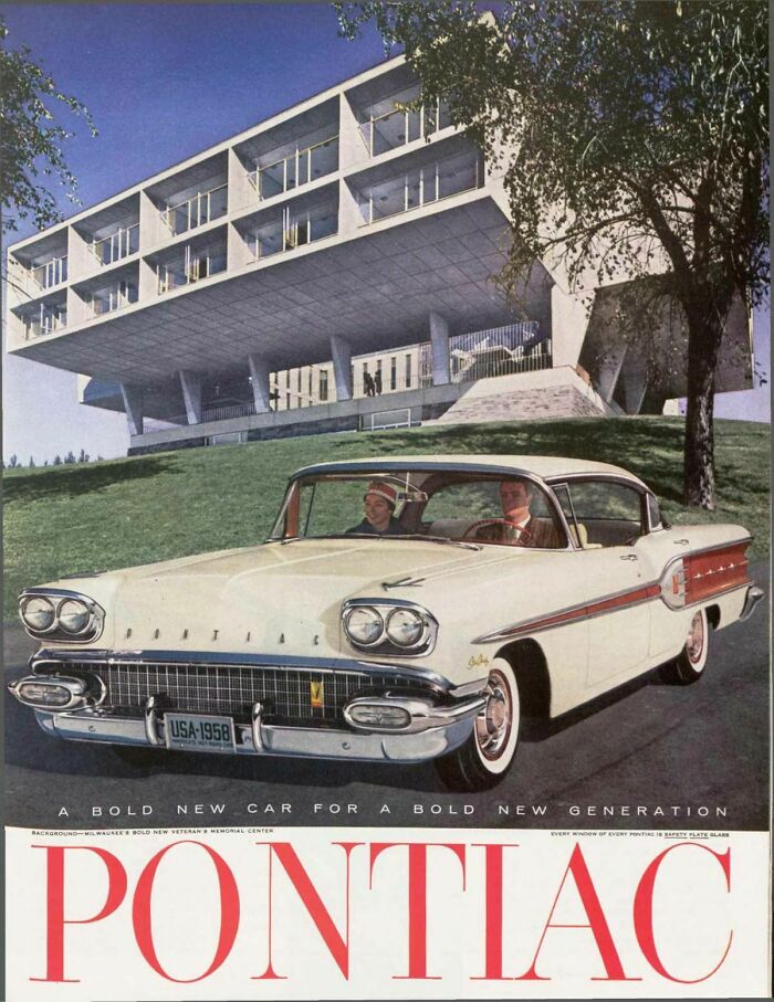 1958 Pontiac car retro ad showing vintage vehicle with two people in front of modernist building, capturing a different era.
