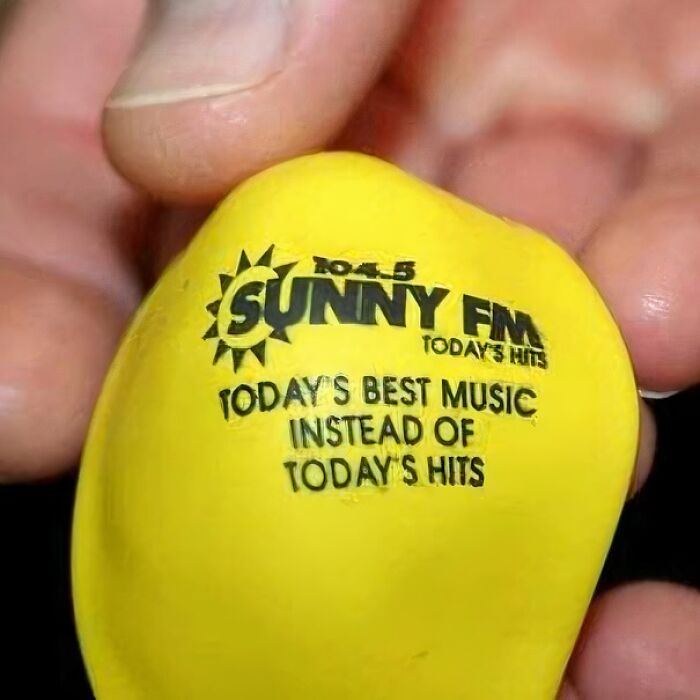 Yellow promotional item showing a misprint with hilarious instructions fail reading todays best music instead of todays hits.