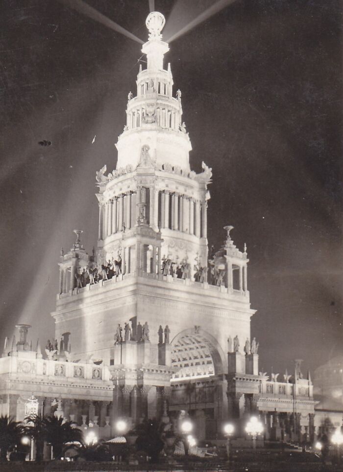 Historic building illuminated at night, showcasing intricate architecture and sculptures, representing lost interesting buildings.