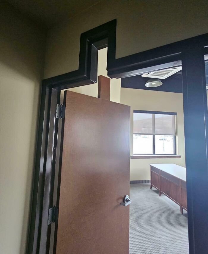 Door with a deeply cursed crooked frame and hinges causing a DIY project to fail visually and functionally.