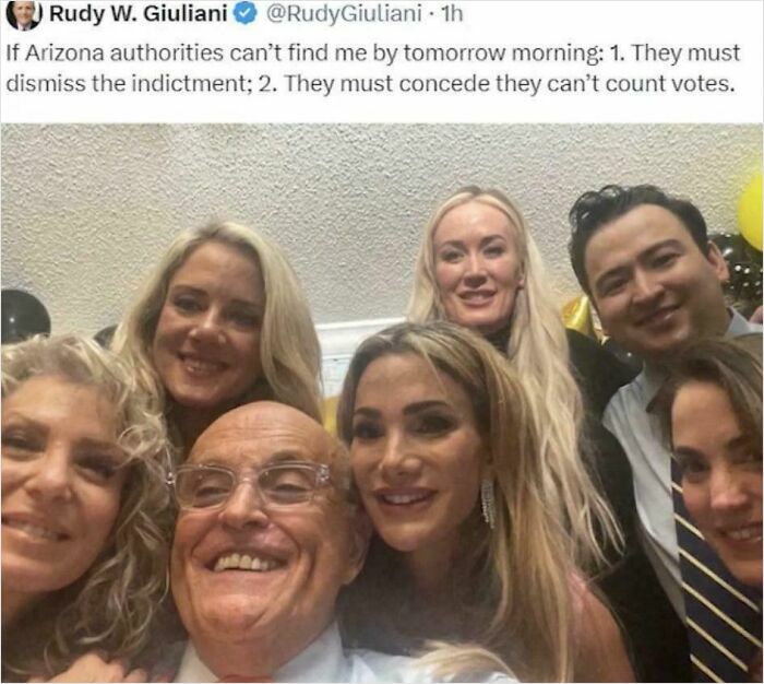 Group selfie of premature celebrators smiling at a party, illustrating moments of embarrassing early celebrations.