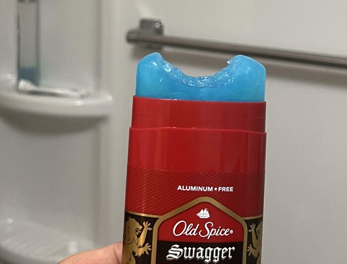 Partially used Old Spice deodorant with a bite taken out of it, showcasing a funny photo for humor and instant reaction.