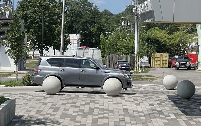 The Way These Concrete Balls Lined Up To Look Like Wheels