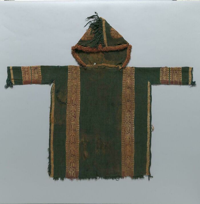 Antique hooded garment with intricate patterns, almost perfectly preserved, showcasing the secrets of history.