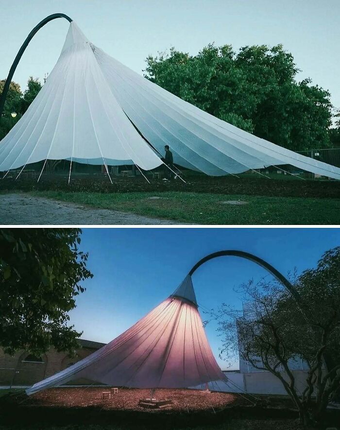 Modern architectural structure resembling a giant lamp with a fabric shade, showcasing creativity in design and light.