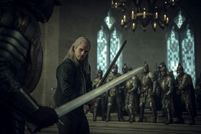 A Knight Of The Seven Kingdoms season 2 scene featuring sword fight preparation in a medieval castle with armored knights.