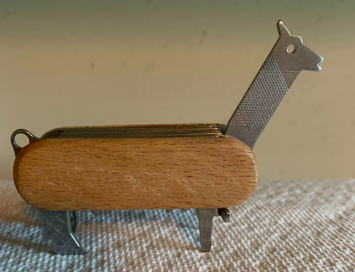 Wooden multi-tool shaped like a giraffe, one of the interesting tools that might solve small annoying problems.
