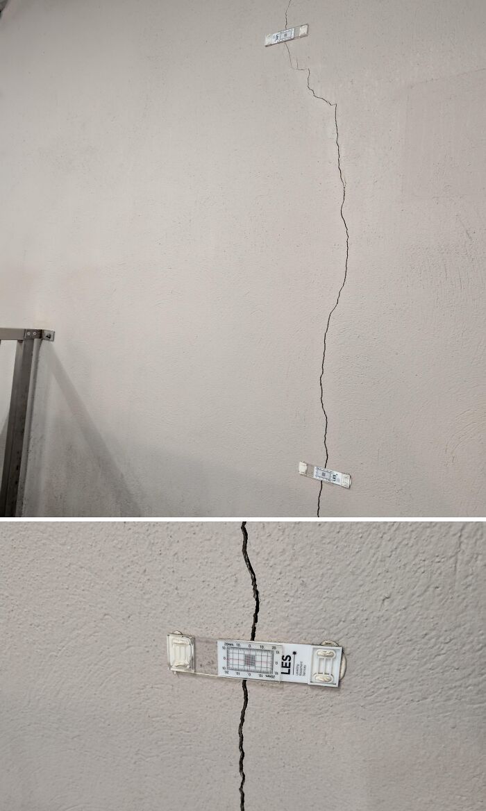 Wall crack with measuring tool applied vertically, illustrating tools that might solve an annoying little problem.