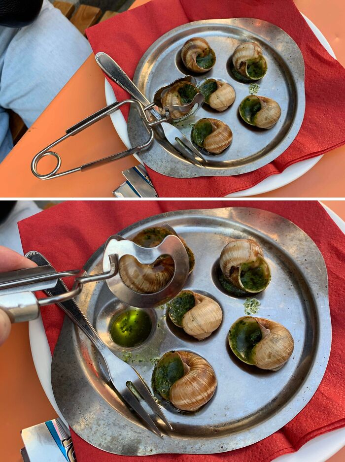 Metal snail shell holder tool on a plate with escargot, designed to solve an annoying little problem with eating snails.