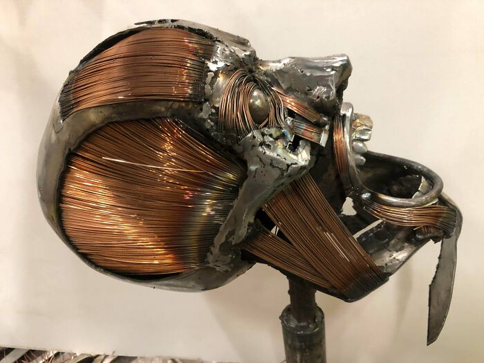 Metalworkers crafted a detailed skull sculpture combining copper wires and steel, showcasing remarkable skill and creativity.
