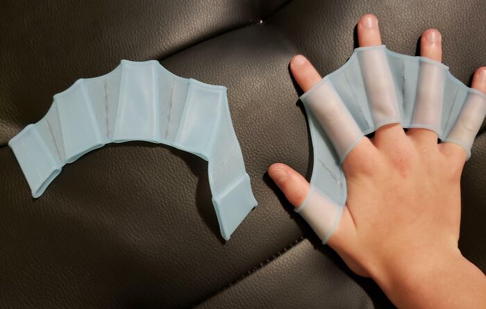Flexible finger protectors worn on a hand, demonstrating a useful tool that might solve an annoying little problem.