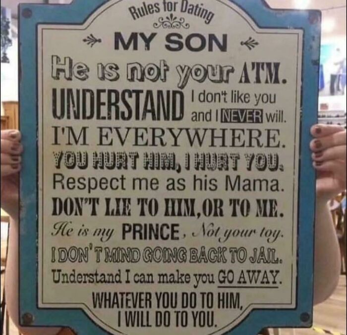 Sign with cringe dating rules warning others to respect a mother’s son, emphasizing protectiveness and threats in bold text.