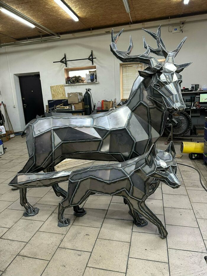 Geometric metal sculptures of a deer and a fox crafted by metalworkers showcasing remarkable skill and creativity.