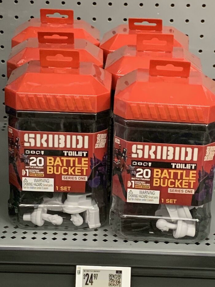 Skibidi Toilet Battle Bucket toy sets on a store shelf with price tag, packaged in red and black plastic containers.