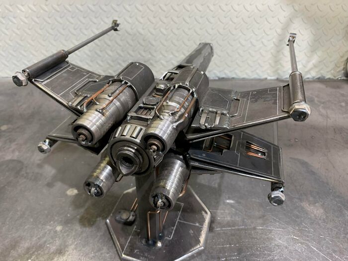 Metalworkers crafted a remarkable metal spaceship model defying physics and logic, showcasing expert metalworking skills.