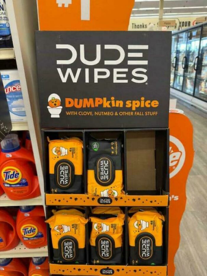 Display of Dude Wipes in pumpkin spice scent, a cringe product showing awkward fall-themed branding in store.