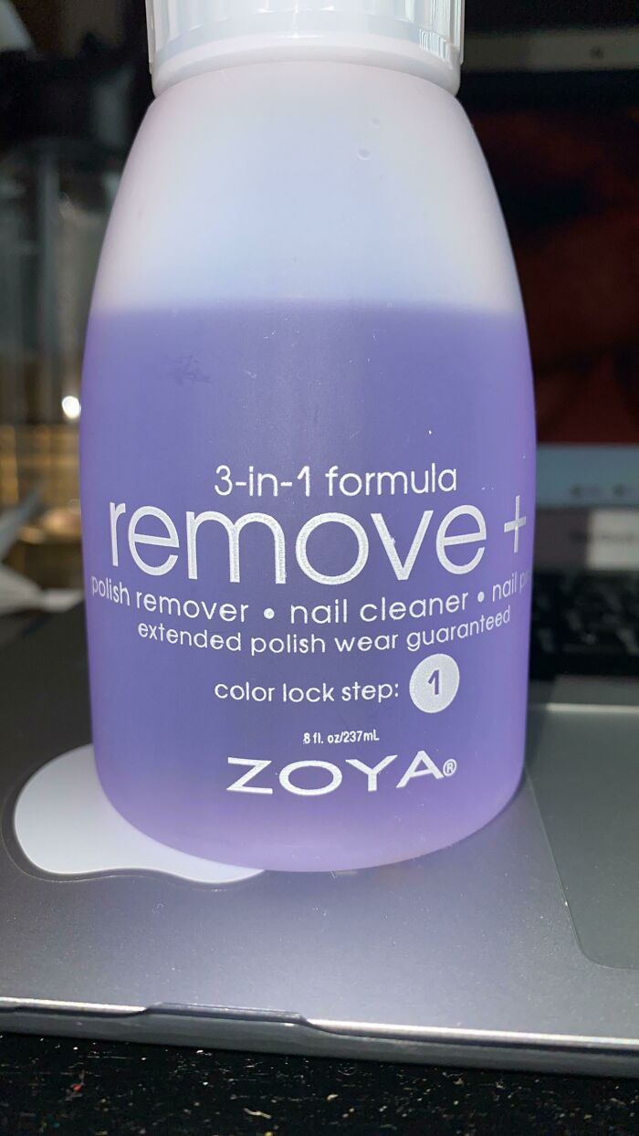 Purple bottle of 3-in-1 polish remover featuring nail cleaner and polish protection with extended wear formula.